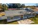 Backyard view of the house showing patio and fence at 3720 Ne 28Th Ter, Ocala, FL 34479