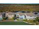 Back of two story light blue house with canal view and patio at 455 Blue Cypress Dr, Groveland, FL 34736