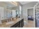 Bathroom with double vanity, granite countertop, and spacious layout at 455 Blue Cypress Dr, Groveland, FL 34736