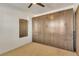 Bedroom with a built-in murphy bed and ample closet space at 455 Blue Cypress Dr, Groveland, FL 34736