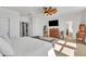 Primary bedroom with a king-size bed and ensuite bathroom access at 455 Blue Cypress Dr, Groveland, FL 34736