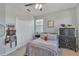 Charming bedroom with a double bed, dresser, and closet at 455 Blue Cypress Dr, Groveland, FL 34736
