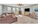 Spacious bonus room with lake view and ceiling fan at 455 Blue Cypress Dr, Groveland, FL 34736