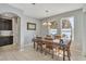 Bright dining room with lake view and wooden table at 455 Blue Cypress Dr, Groveland, FL 34736