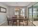 Dining room offers a lake view and plenty of natural light at 455 Blue Cypress Dr, Groveland, FL 34736