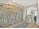 Entryway with rustic barn doors leading to living area at 455 Blue Cypress Dr, Groveland, FL 34736