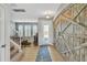 Inviting entryway with rustic barn doors and view of staircase and living room at 455 Blue Cypress Dr, Groveland, FL 34736