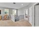 Upper hallway showcasing access to bedrooms and a staircase at 455 Blue Cypress Dr, Groveland, FL 34736