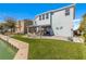 House exterior with lake access and patio at 455 Blue Cypress Dr, Groveland, FL 34736