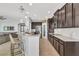 Modern kitchen with granite countertops and stainless steel appliances at 455 Blue Cypress Dr, Groveland, FL 34736
