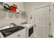 Laundry room with washer, dryer and shelving at 455 Blue Cypress Dr, Groveland, FL 34736