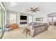 Spacious living room with fireplace and lake access at 455 Blue Cypress Dr, Groveland, FL 34736