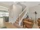 Elegant staircase with white railing, leading to the upper level at 455 Blue Cypress Dr, Groveland, FL 34736