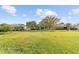 Large backyard with green lawn, providing ample space at 8347 Sw 84Th Place Rd, Ocala, FL 34481