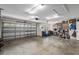 Large garage with storage shelving and space for multiple vehicles at 8470 Sw 82Nd Cir, Ocala, FL 34481