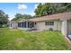 Home exterior showcasing a screened porch and backyard at 8814 Sw 93Rd Ln # C, Ocala, FL 34481