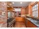 Spacious kitchen with stainless steel appliances and brick accents at 1150 Sw 43Rd Pl, Ocala, FL 34471