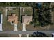 Aerial view of two houses with fenced yards and driveways at 17023 Sw 41St Avenue Rd, Ocala, FL 34473