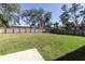 Spacious backyard with a large grassy area and privacy fence at 17023 Sw 41St Avenue Rd, Ocala, FL 34473