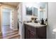Updated bathroom with dark vanity, vessel sink, and bathtub at 17023 Sw 41St Avenue Rd, Ocala, FL 34473