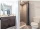 Clean bathroom with shower stall and dark vanity at 17023 Sw 41St Avenue Rd, Ocala, FL 34473