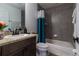 Clean bathroom, featuring a teal shower curtain and a bathtub at 17023 Sw 41St Avenue Rd, Ocala, FL 34473