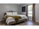 Spacious bedroom with a king-size bed and large window at 17023 Sw 41St Avenue Rd, Ocala, FL 34473