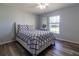 Cozy bedroom with a full-size bed and large window at 17023 Sw 41St Avenue Rd, Ocala, FL 34473