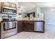 Modern kitchen with stainless steel appliances and a large island at 17023 Sw 41St Avenue Rd, Ocala, FL 34473