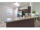Kitchen features a breakfast bar with modern design at 17023 Sw 41St Avenue Rd, Ocala, FL 34473