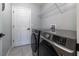Laundry room with modern washer and dryer, and additional storage at 17023 Sw 41St Avenue Rd, Ocala, FL 34473