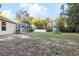 Large backyard with screened enclosure, playset, and shed at 20390 Sw 57Th St, Dunnellon, FL 34431