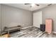 Bedroom with wood-like floors and a double door closet at 20390 Sw 57Th St, Dunnellon, FL 34431