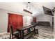 Casual dining area with a large table, pendant lighting, and hardwood floors at 20390 Sw 57Th St, Dunnellon, FL 34431