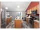 Spacious kitchen with island, stainless steel appliances, and wood cabinets at 20390 Sw 57Th St, Dunnellon, FL 34431
