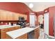 Modern kitchen with ample cabinetry and a breakfast bar at 20390 Sw 57Th St, Dunnellon, FL 34431