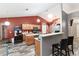 Kitchen with an island, wood cabinets, and stainless steel appliances at 20390 Sw 57Th St, Dunnellon, FL 34431