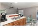 Functional kitchen with a breakfast bar and view of the backyard at 20390 Sw 57Th St, Dunnellon, FL 34431