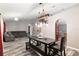 Open living room featuring a comfortable sectional sofa and unique lighting at 20390 Sw 57Th St, Dunnellon, FL 34431