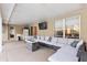 Covered patio with sectional sofa and fire pit at 20390 Sw 57Th St, Dunnellon, FL 34431