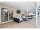 Covered patio with sectional sofa and fire pit at 20390 Sw 57Th St, Dunnellon, FL 34431