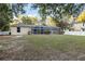 Private backyard with screened pool and lush landscaping at 20390 Sw 57Th St, Dunnellon, FL 34431
