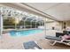Spacious pool area with lounge chairs and fire pit at 20390 Sw 57Th St, Dunnellon, FL 34431