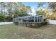 Backyard oasis featuring a refreshing pool and screened enclosure at 20390 Sw 57Th St, Dunnellon, FL 34431