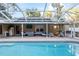 Screened pool and patio with comfortable seating at 20390 Sw 57Th St, Dunnellon, FL 34431