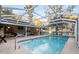 Relaxing screened pool area with patio furniture at 20390 Sw 57Th St, Dunnellon, FL 34431