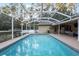 Large screened pool with ample outdoor seating at 20390 Sw 57Th St, Dunnellon, FL 34431
