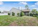 Backyard with screened patio and a partially visible fence at 21174 Sw Peach Blossom St, Dunnellon, FL 34431