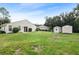Spacious backyard with shed and partial view of house at 21174 Sw Peach Blossom St, Dunnellon, FL 34431
