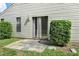 Small backyard patio with sliding glass door access at 21174 Sw Peach Blossom St, Dunnellon, FL 34431